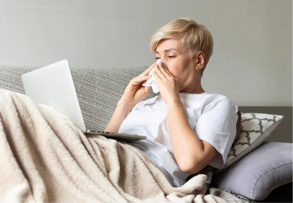 a woman blowing her nose